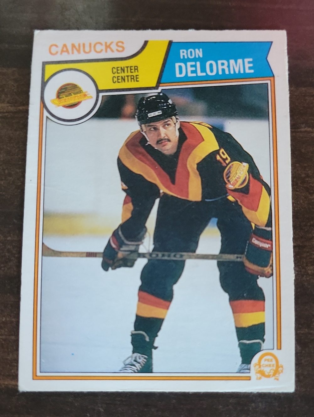 1983/84 OPC Ron Delorme Canucks Hockey Card - Black, Red, Yellow